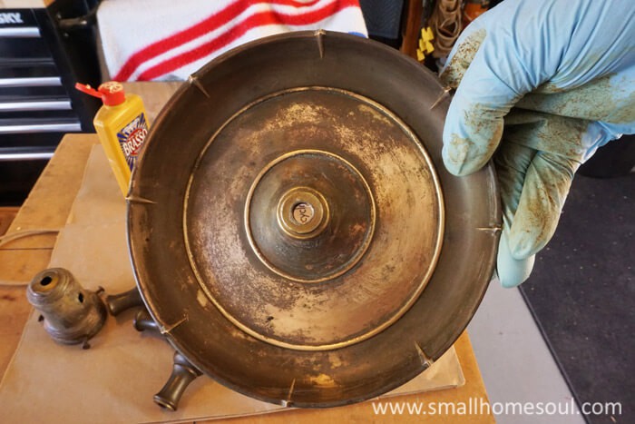 Use brasso to clean the grunge off your brass lamp.