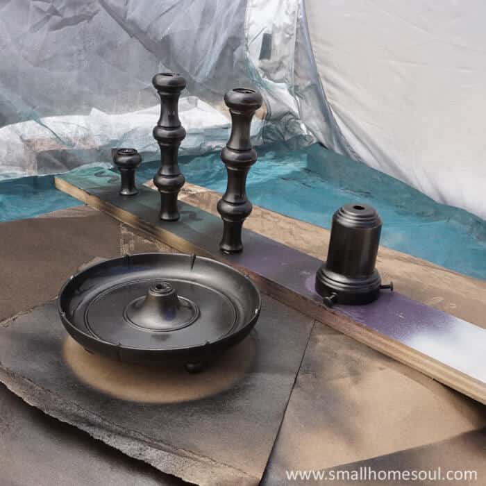 Take apart the brass lamp and spray paint them for the best finish.