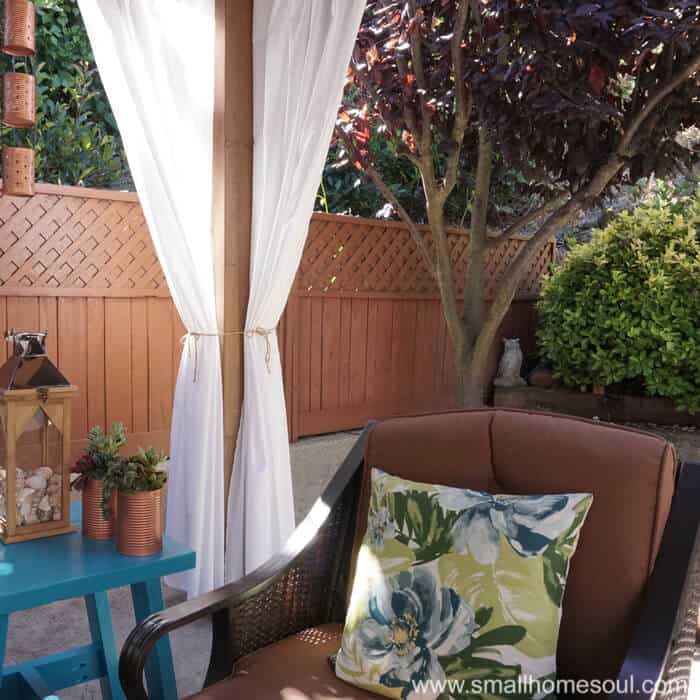 Simple curtains add the perfect touch to a relaxing backyard retreat.