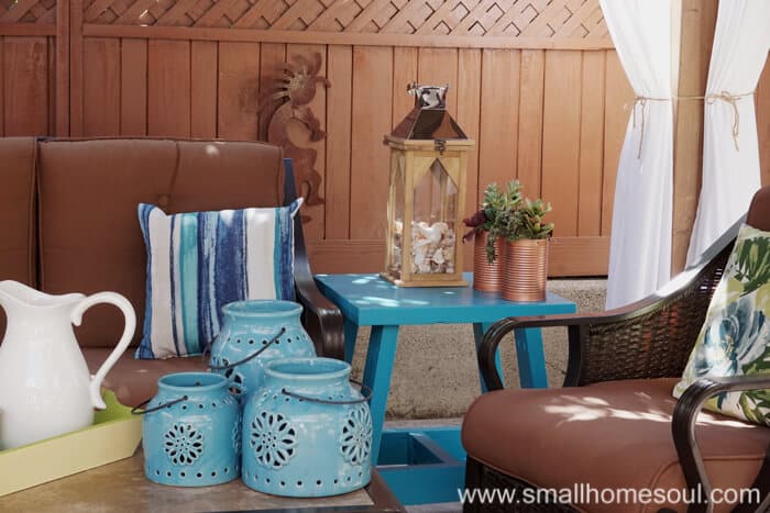 Every relaxing backyard retreat needs a good lantern on the side table.