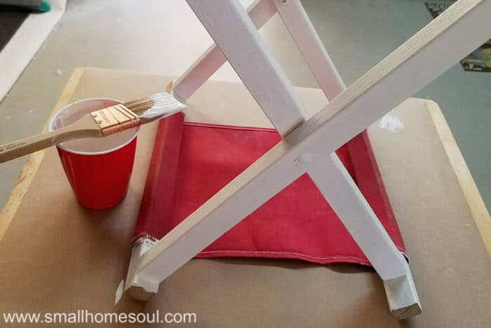 Folding stool gets a new coat of white chalky paint.