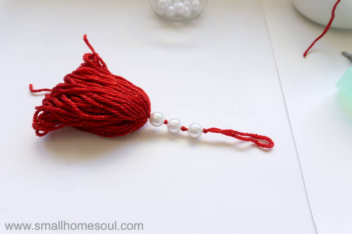 Christmas Tassel Ornament with beads attached.