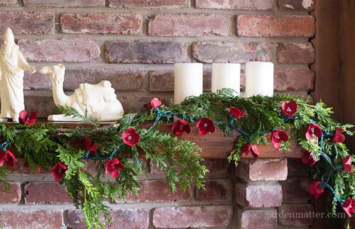 Red Christmas Decor Hearth and Vine red garland.