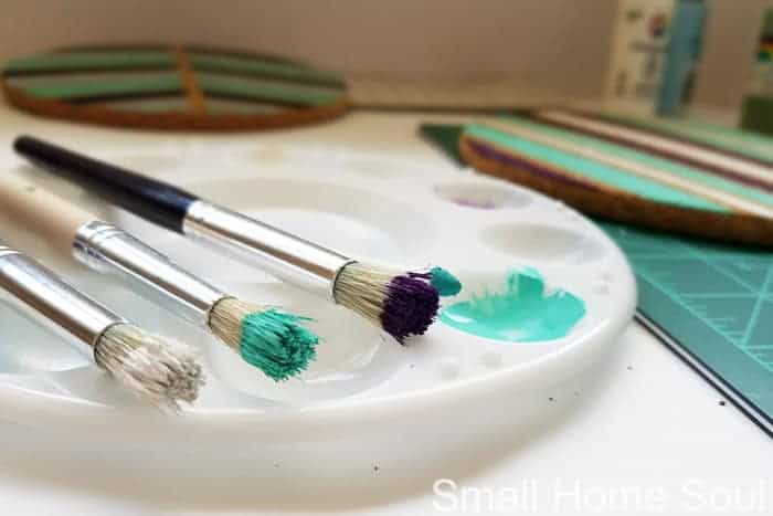 White, turquoise, and purple paint for painted ikea trivets.