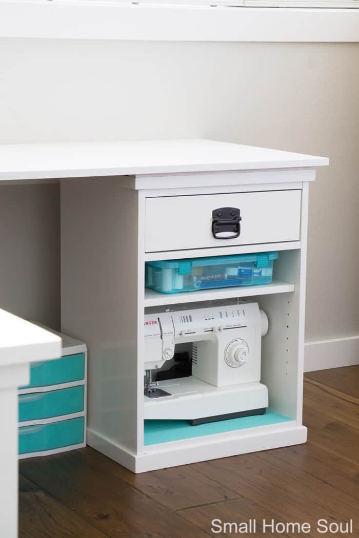 Sewing machine storage in office makeover.