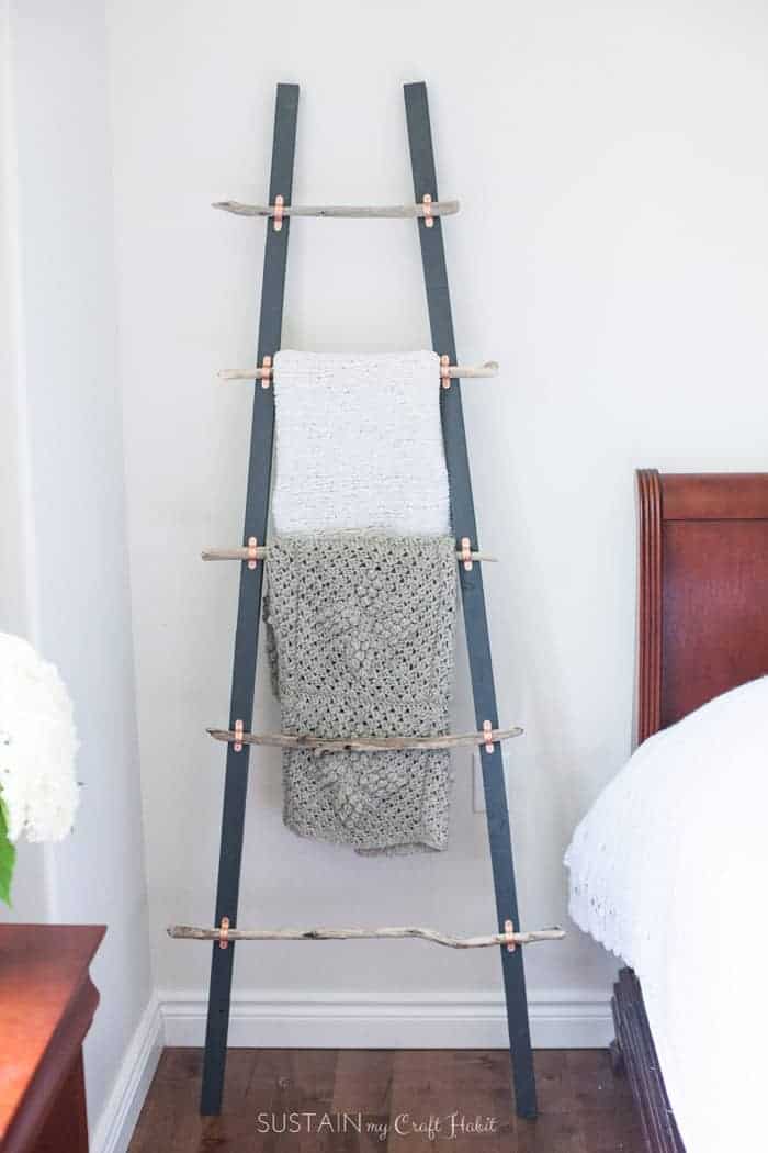 Creative coastal decor in a blanket ladder.