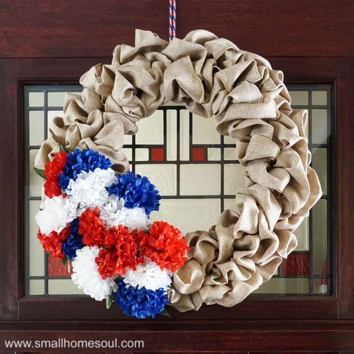 Closeup of July 4th Wreath hung on front door for 4th of July.