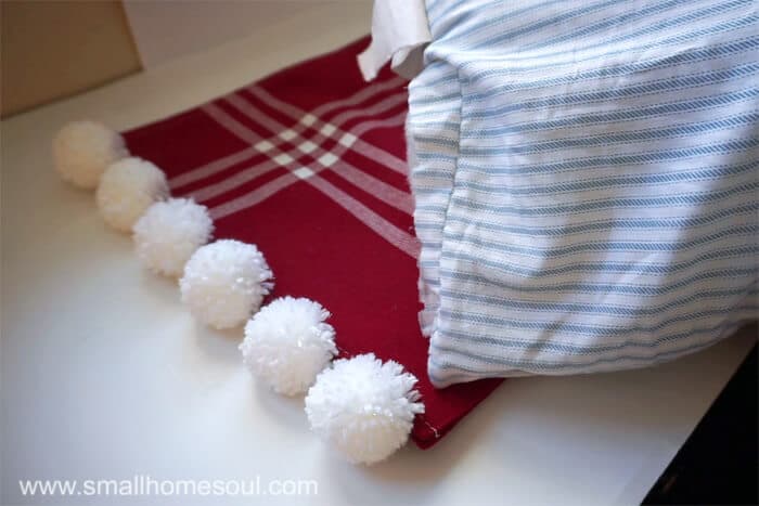 Stuff the Christmas Pom Pom pillow with batting.