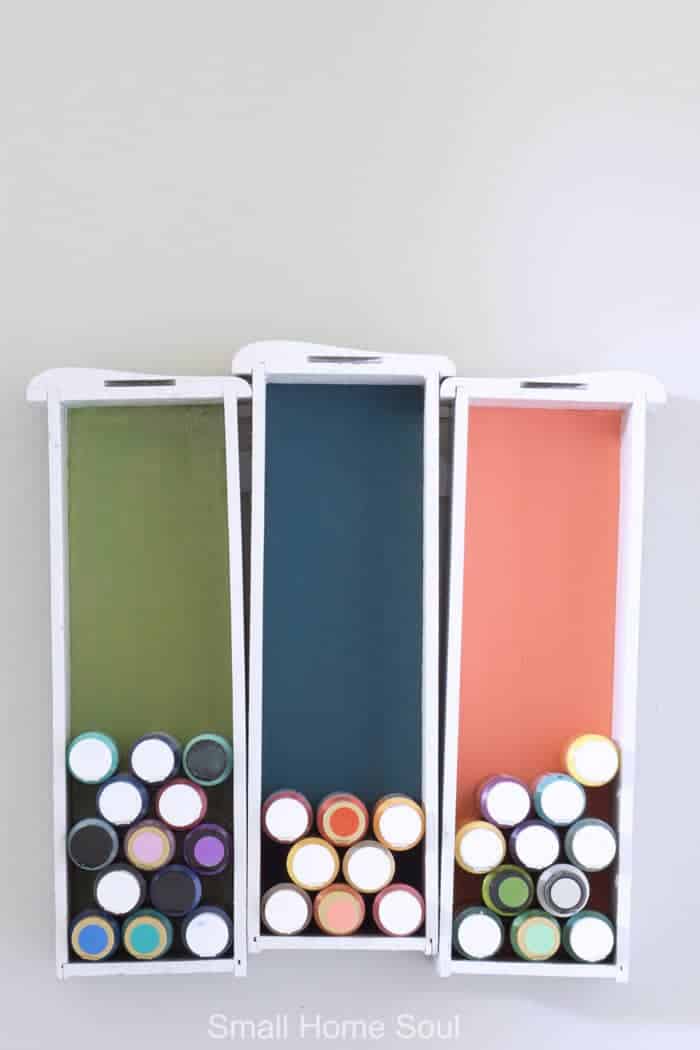 Creative Craft Paint Storage hanging on the wall in the office.